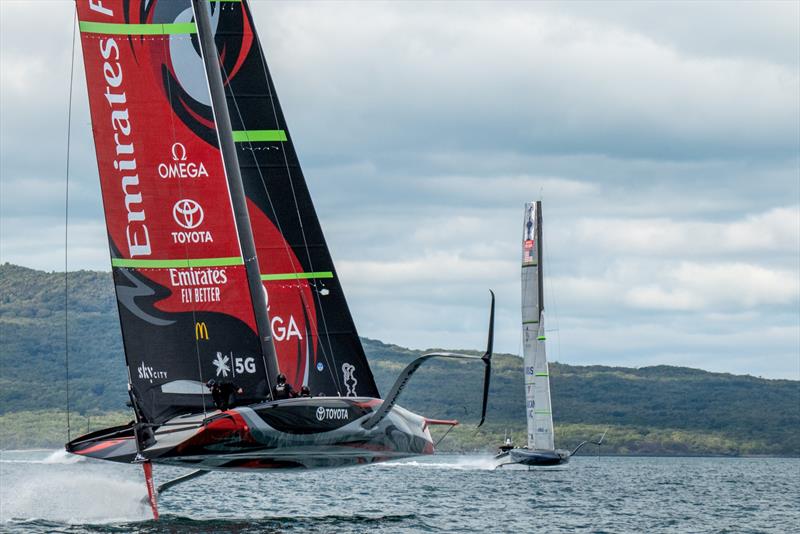 Emirates Team New Zealand and American Magic cross tacks in the Rangitoto Channel photo copyright Emirates Team New Zealand taken at Royal New Zealand Yacht Squadron and featuring the AC75 class