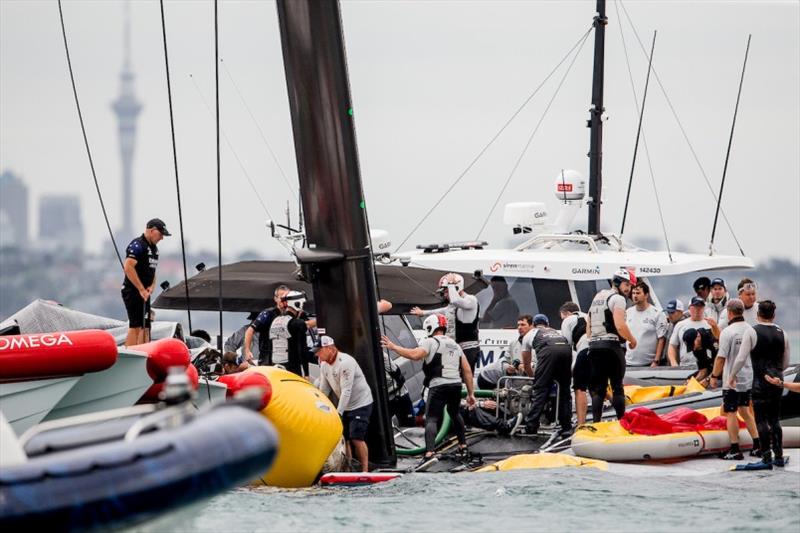 Four America's Cup teams, at times fierce competitors, work together to keep PATRIOT afloat photo copyright Sailing Energy / American Magic taken at  and featuring the AC75 class