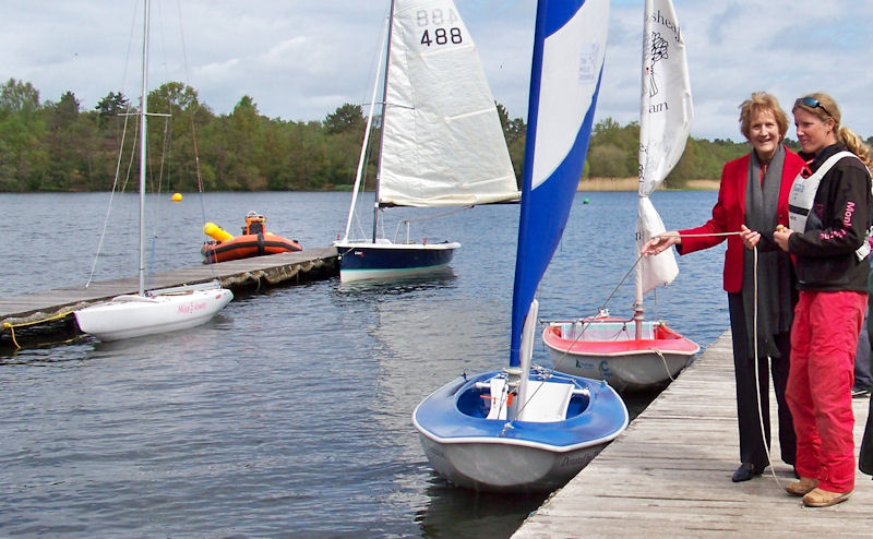Megan Pascoe (right) takes a break to launch a new Sailability Access dinghy during the Frensham 2.4mR open photo copyright Jim Morley taken at Frensham Pond Sailing Club and featuring the Hansa class