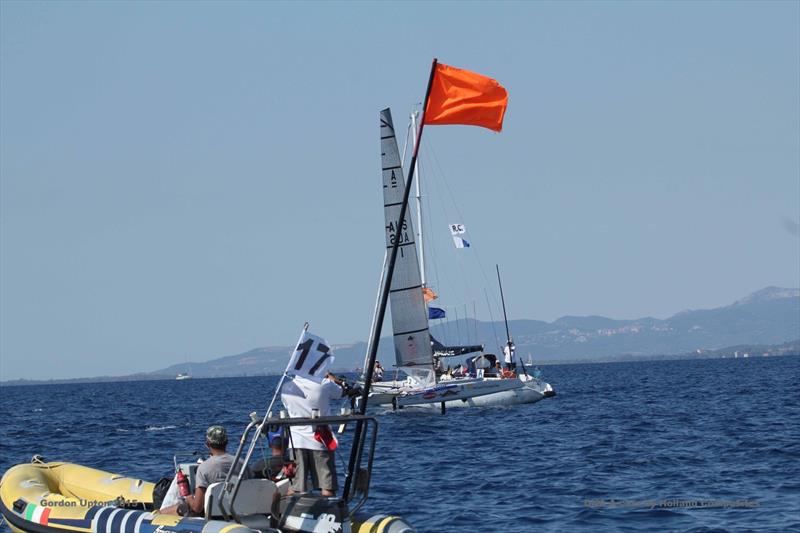 Ashby crossed the line flying for his 9th World Championship title at the A Class Cat Worlds at Punta Ala photo copyright Gordon Upton taken at Centro Velico Punta Ala and featuring the A Class Catamaran class