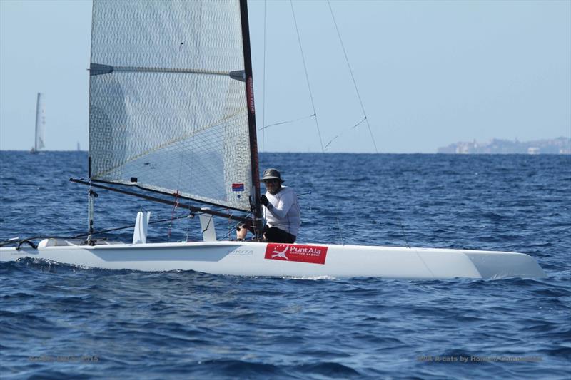 ‘Dr Georg' Ruetter crossed the line on the final day of the A Class Cat Worlds at Punta Ala photo copyright Gordon Upton taken at Centro Velico Punta Ala and featuring the A Class Catamaran class