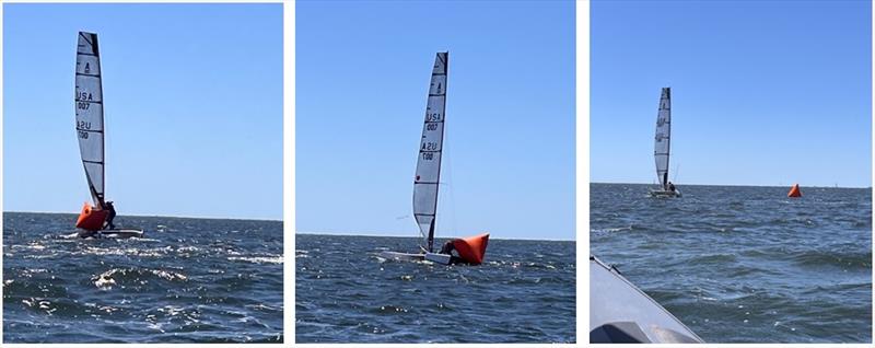 Mike Krantz (USA 007) capsizes on top of the weather mark in Race 1 - A-Class Catamaran North American Championships photo copyright Suzie Domagala taken at Pensacola Yacht Club and featuring the A Class Catamaran class