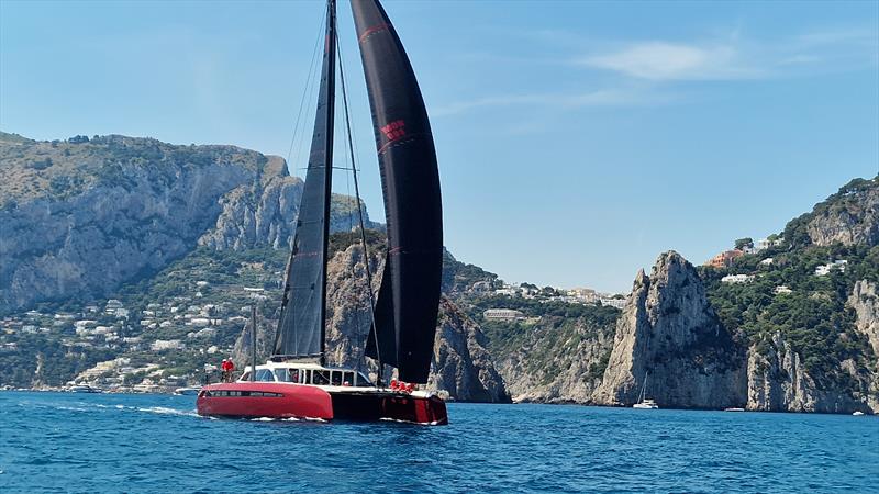 Lord Irvine Laidlaw's Gunboat 80 Highland Fling 18 passes the Faraglioni rocks en route to winning the race around Capri at the IMA Maxi Europeans - photo © James Tomlinson