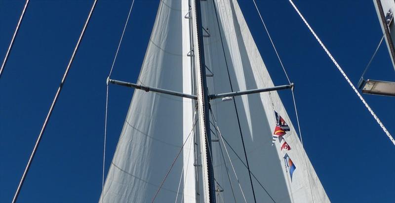 Attaching flags to Flag Halyards photo copyright Rob Murray taken at  and featuring the Cruising Yacht class