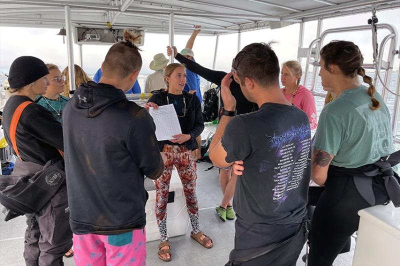 The Southernmost Coral Restoration Club participates in a pre-dive briefing as part of an Iconic Reefs pilot maintenance program at Eastern Dry Rocks. - photo © Abigail Clark