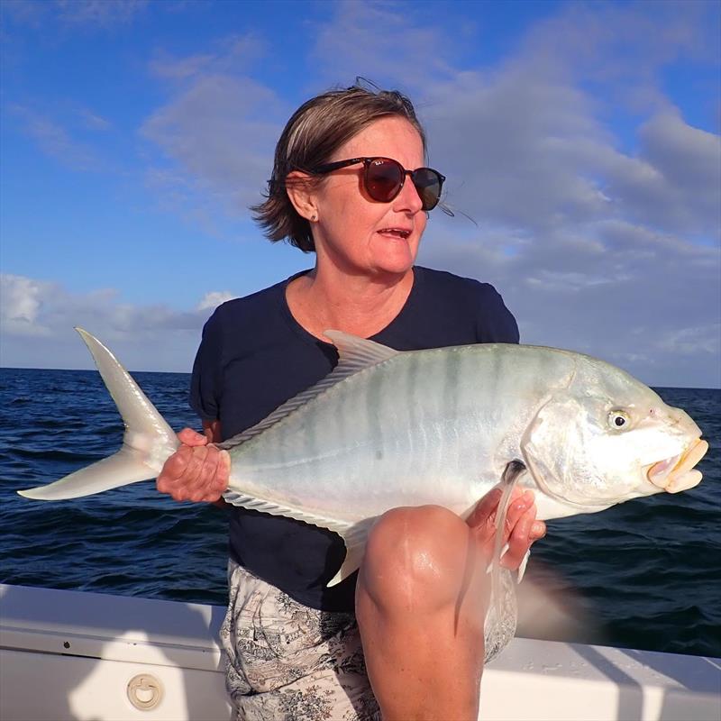 Deb with a golden trevally she caught on a charter with Tri from Fraser Guided Fishing photo copyright Fisho's Tackle World taken at  and featuring the Environment class