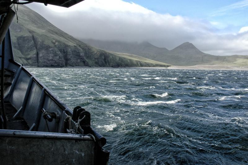 A view of Alaska's shores from the port side - a cloud hangs over the mountains photo copyright NOAA Fisheries taken at  and featuring the Environment class