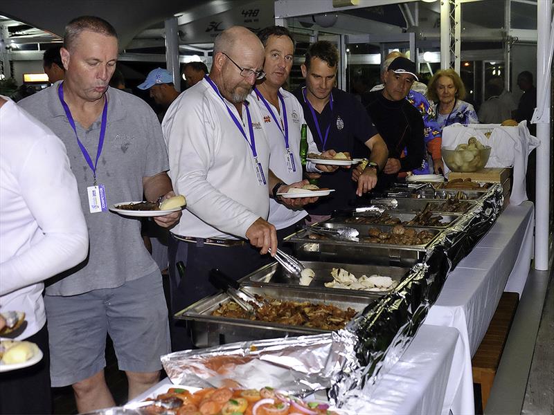 Partaking in the world famous David and Sue Healey BBQ after racing day 4 of the 2018 Etchells World Championship photo copyright Mitchell Pearson / SurfSailKite taken at Royal Queensland Yacht Squadron and featuring the Etchells class