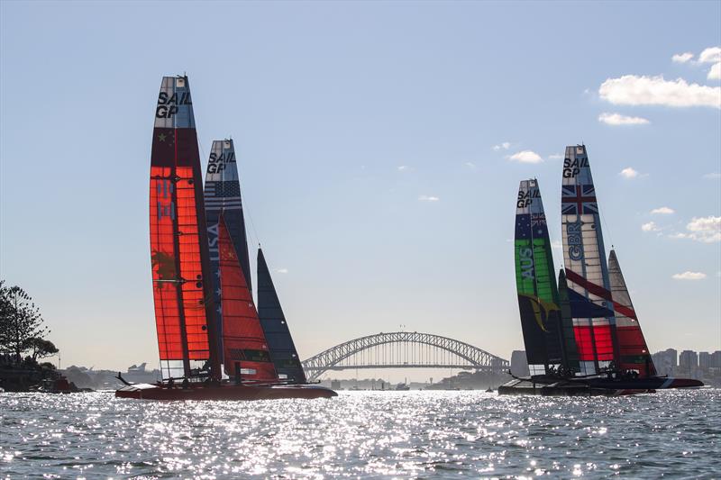 The fleet race past Sydney Harbour Bridge in the second race on day 1 of SailGP Sydney photo copyright Lloyd Images / SailGP taken at  and featuring the F50 class