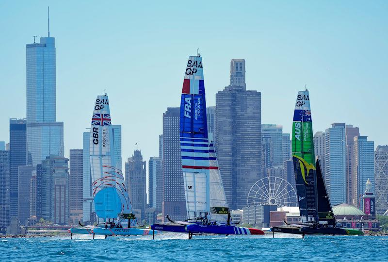 Great Britain SailGP Team helmed by Ben Ainslie, France SailGP Team helmed by Quentin Delapierre, and Australia SailGP Team helmed by Tom Slingsby sail past the Chicago skyline ahead of the T-Mobile United States Sail Grand Prix photo copyright Bob Martin for SailGP taken at  and featuring the F50 class