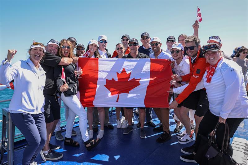 Supporters of the Canada SailGP Team hold the flag as they watch the action from the Adrenaline Lounge spectator boat on Race Day 1 of the T-Mobile United States Sail Grand Prix | Chicago at Navy Pier, Lake Michigan, Season 3 photo copyright Katelyn Mulcahy for SailGP taken at  and featuring the F50 class