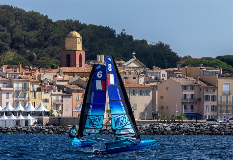 Young sailors in the Inspire Racing x WASZP program sail past the bell tower and old town of Saint Tropez during a practice session ahead of the Range Rover France Sail Grand Prix in Saint Tropez photo copyright David Gray/SailGP taken at Société Nautique de Saint-Tropez and featuring the F50 class