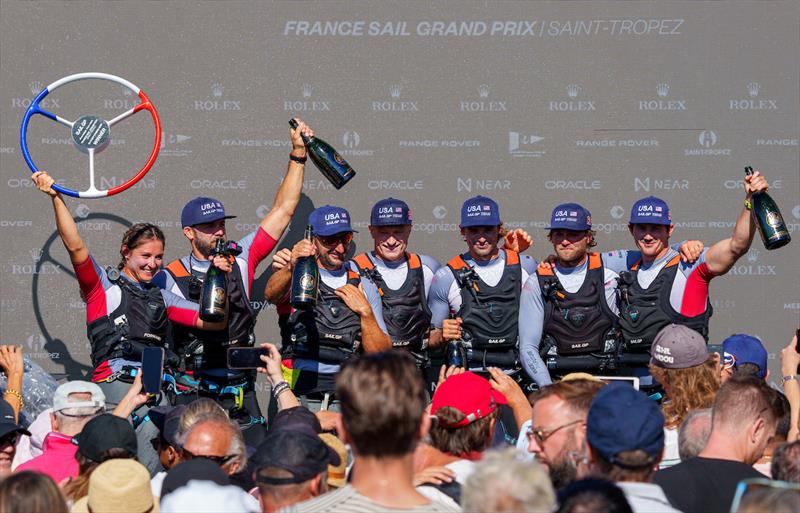 USA SailGP Team helmed by Jimmy Spithill pose with the trophy and Champagne Barons de Rothschild after winning the Range Rover France Sail Grand Prix in Saint Tropez, France photo copyright Ricardo Pinto for SailGP taken at  and featuring the F50 class