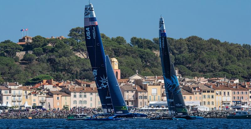 USA SailGP Team  and New Zealand SailGP Team  sail past the Old Town and Bell Tower of Saint Tropez on Race Day 2 of the Range Rover France Sail Grand Prix in Saint Tropez photo copyright Bob Martin/SailGP taken at Société Nautique de Saint-Tropez and featuring the F50 class