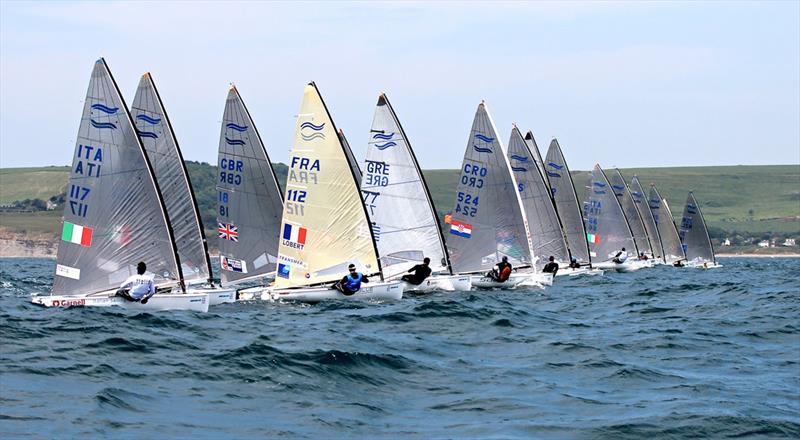 Start of race 3 on day two of the ISAF Sailing World Cup Weymouth photo copyright Robert Deaves taken at Weymouth & Portland Sailing Academy and featuring the Finn class
