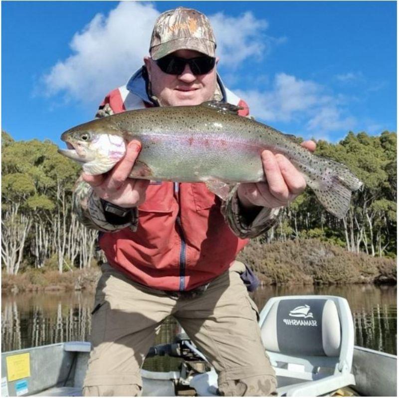 Tommy Darke with one of several fat rainbows caught at Brady's on a Tassie Devil photo copyright Spot On Fishing Hobart taken at  and featuring the Fishing boat class
