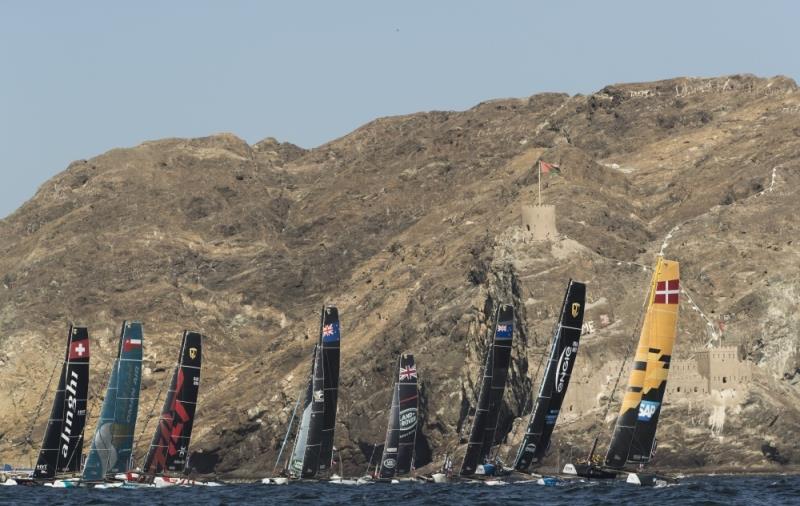 The Extreme Sailing Series 2017. Muscat. Oman. The fleet racing close to the shore and historic town of Mutrah photo copyright Lloyd Images taken at Oman Sail and featuring the GC32 class