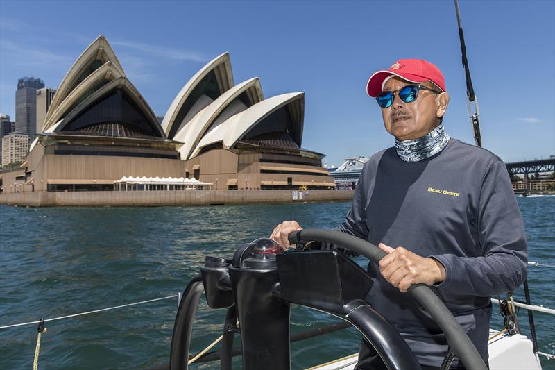 Karl Kwok behind the helm of his Beau Geste (80) and in front of 'that' building by the late Jørn Utzon - photo © Andrea Francolini