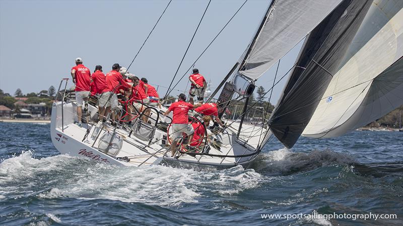 Wild Oats X crew under kite in the SOLAS race photo copyright Beth Morley / www.sportsailingphotography.com taken at Cruising Yacht Club of Australia and featuring the IRC class