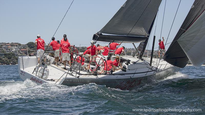 Wild Oats X crew under kite in the SOLAS race photo copyright Beth Morley / www.sportsailingphotography.com taken at Cruising Yacht Club of Australia and featuring the IRC class