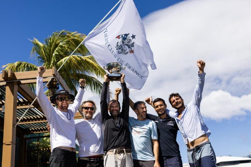 The crew of Cocody lift the Yacht Club de France Trophy - RORC Transatlantic Race - photo © Arthur Daniel / RORC