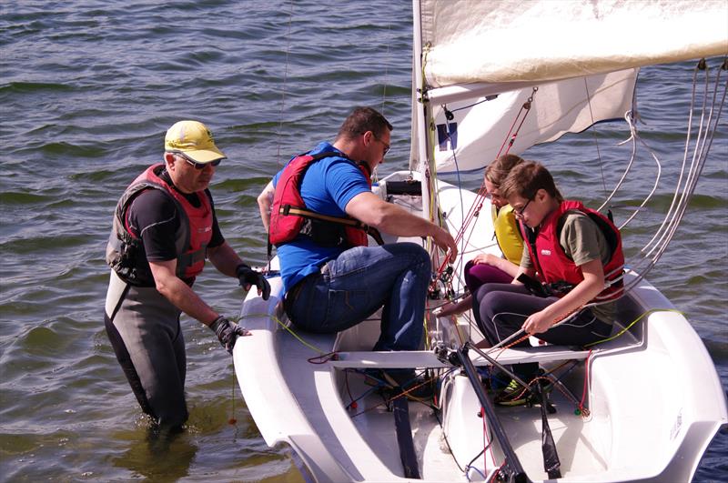 Guy Boswell takes the Orme family for a sample sail as Llandegfedd Sailing Club Push the Boat Out photo copyright Andy Howard taken at Llandegfedd Sailing Club and featuring the 2000 class