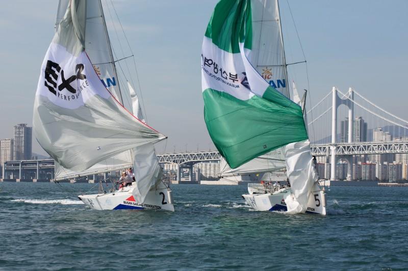 Shifty and puffy conditions close to the Gwangan Bridge in the Busan Cup Women's International Match Race photo copyright Kim Wolf / WIM Series taken at  and featuring the Match Racing class