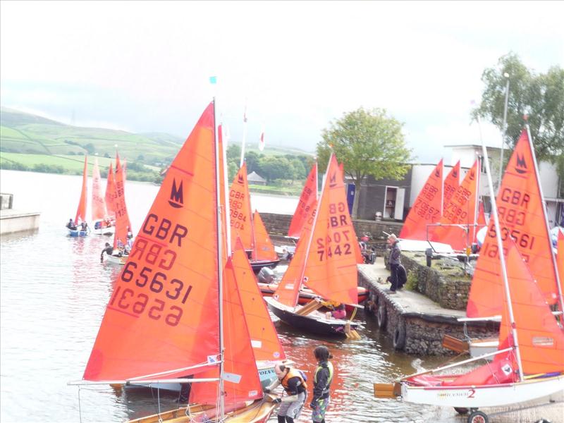A tight squeeze out of the dinghy park during the Hollingworth Lake Mirror open photo copyright Peter Robinson taken at Hollingworth Lake Sailing Club and featuring the Mirror class