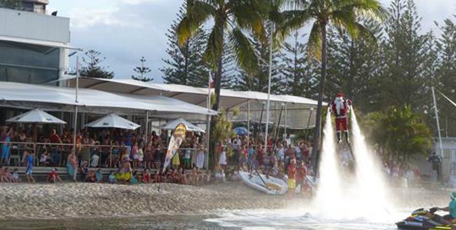 Santa arrives via JetPack Adventures, for Southport Yacht Club's annual Carols on the Broadwater celebrations  photo copyright Bronwen Hemmings taken at 