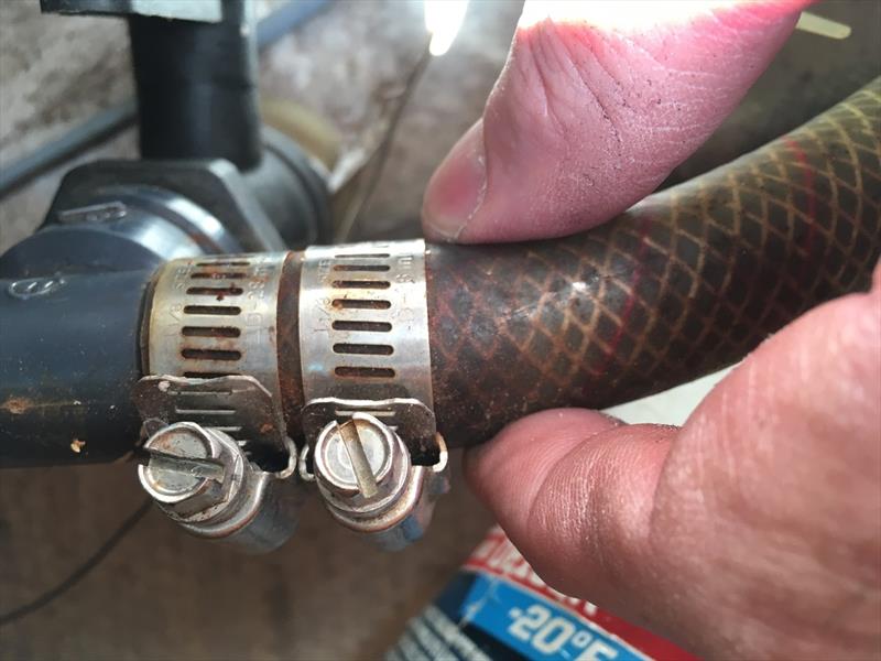 Inspecting hoses should be a part of your boat's Spring Commissioning. Any found too old and stiff, like this decades-old reinforced potable water line, should be on your list to replace photo copyright Scott Croft taken at 