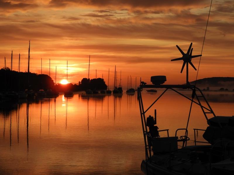 August winner 1 - Joanna Grierson - Early morning sunrise, a time for reflection photo copyright Joanna Grierson taken at Royal Yachting Association