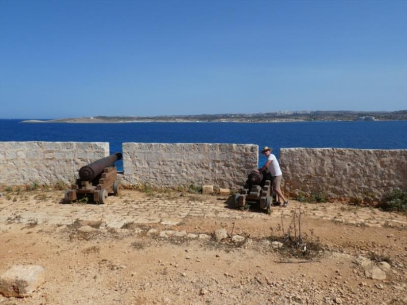 Tony (SV Sweetie) manning the cannons on Comino photo copyright SV Red Roo taken at 