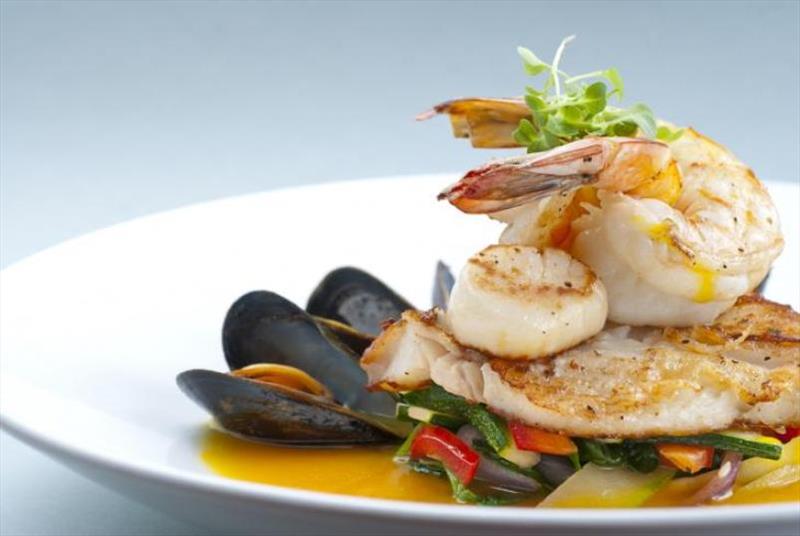 Shrimp, scallops, mussels, and white fish photo copyright iStock taken at 