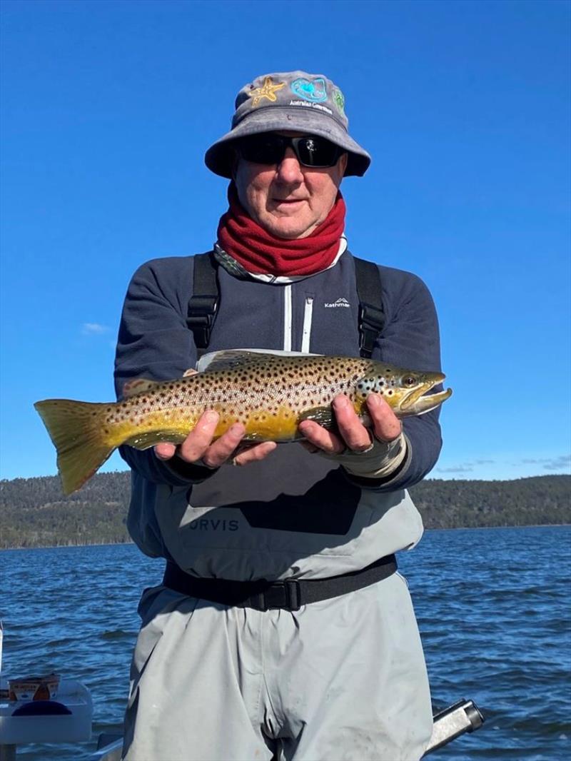 Allan Williams with a Nice little Woods Fish on the fly. - photo © Spot On Fishing Hobart