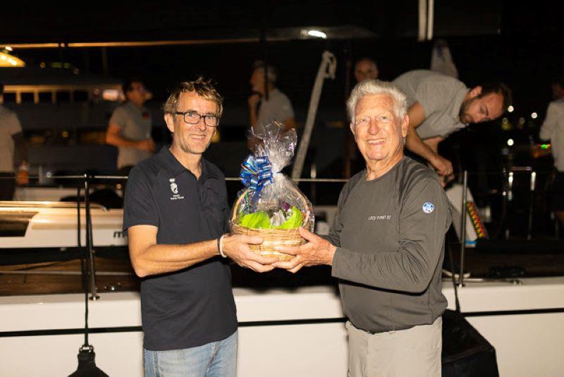 Receiving the Grenada Tourism Authority gift basket - 2024 RORC Transatlantic Race photo copyright Arthur Daniel / RORC taken at Royal Ocean Racing Club