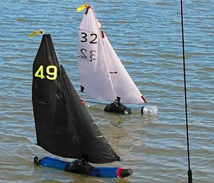 A crucial finish between the top boats during the 2018 Bottle Boat Championship at Waldringfield photo copyright Roger Stollery taken at Waldringfield Sailing Club and featuring the Model Yachting class