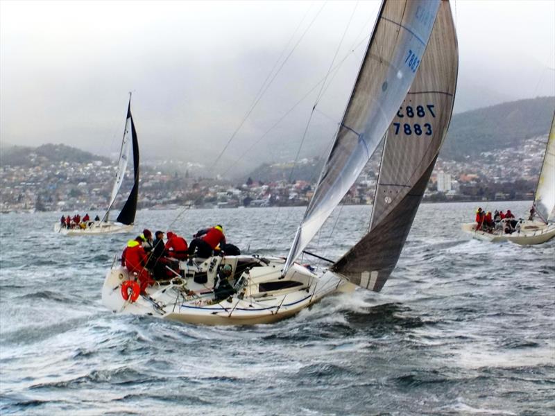 The rugged-up crew pack the windward rail aboard the Mumm 36 Madness in the opening race of the Bellerive Yacht Club Winter Series photo copyright Peter Watson taken at Bellerive Yacht Club and featuring the Mumm 36 class