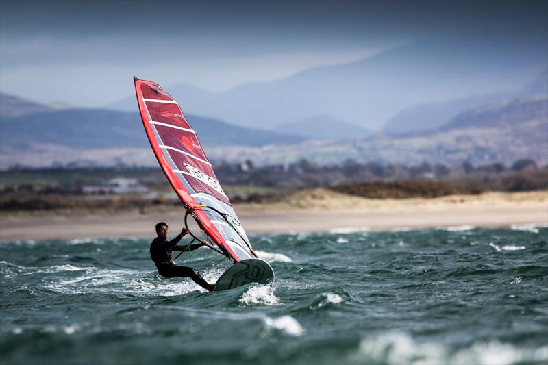 Andy Brown on day 3 of the RYA Youth National Championships photo copyright Paul Wyeth / RYA taken at Plas Heli Welsh National Sailing Academy and featuring the RS:X class