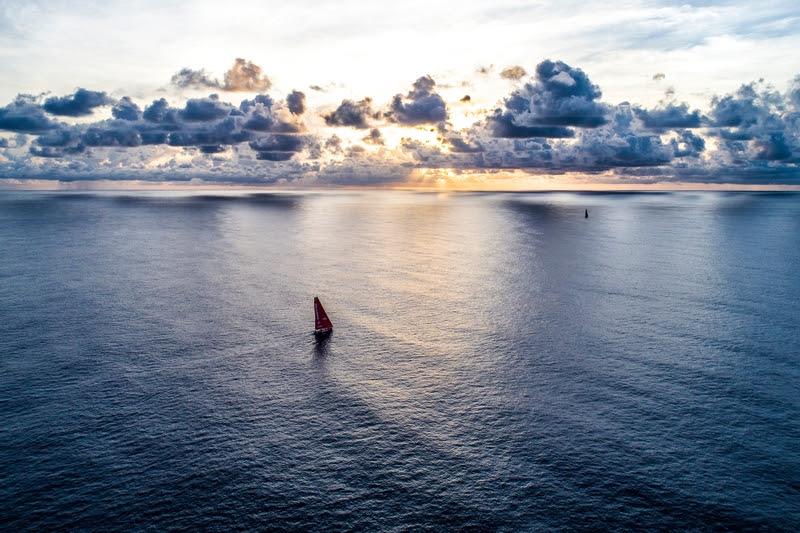 Leg 6 to Auckland, day 14 on board MAPFRE, sunrise near to Salomon Islands, chasing Dongfeng photo copyright Ugo Fonolla taken at  and featuring the IMOCA class