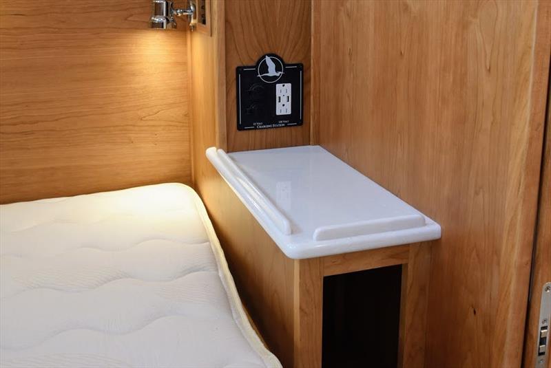 Replace hanging locker with side table (same surface as head & galley) – Charging station moved to above the side table - photo © Jamie Governale