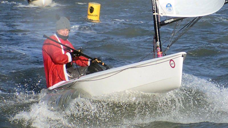 Geoff Havers passing Oakhaven Mark during Santa's Sailing Dash at Lymington Town photo copyright Keith Willis taken at Lymington Town Sailing Club and featuring the  class