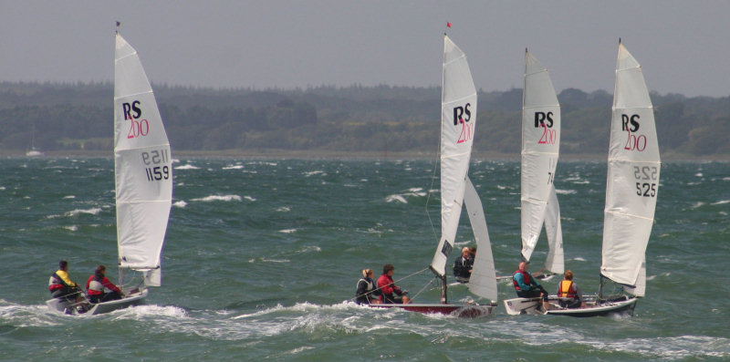 Action from Cowes Dinghy Week photo copyright Brian Augustus / www.sailingimages.co.uk taken at Gurnard Sailing Club and featuring the RS200 class