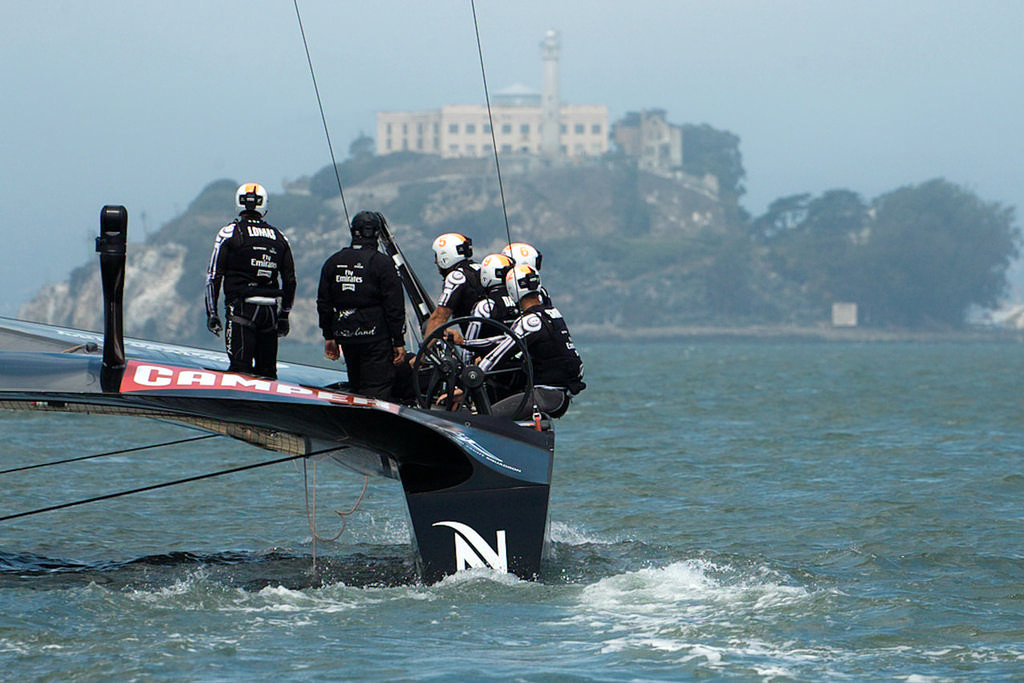 ETNZ crew moves towards the starting area, and the fog, with Alcatraz in the background. - America’s Cup © Chuck Lantz http://www.ChuckLantz.com