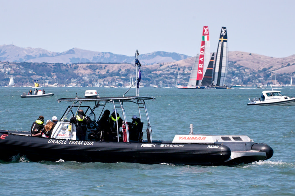 Oracle Team USA members watching the start of the LVC race from aboard their Naiad designed tender. - Louis Vuitton Cup Semi-Final 4 © Chuck Lantz http://www.ChuckLantz.com