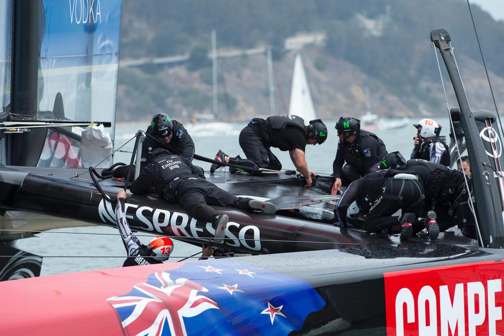Emirates Team New Zealand remove the fairing broken at the top mark bear away in their first race of the Louis Vuitton finals against Luna Rossa Challenge. .17/8/2013 photo copyright Chris Cameron/ETNZ http://www.chriscameron.co.nz taken at  and featuring the  class