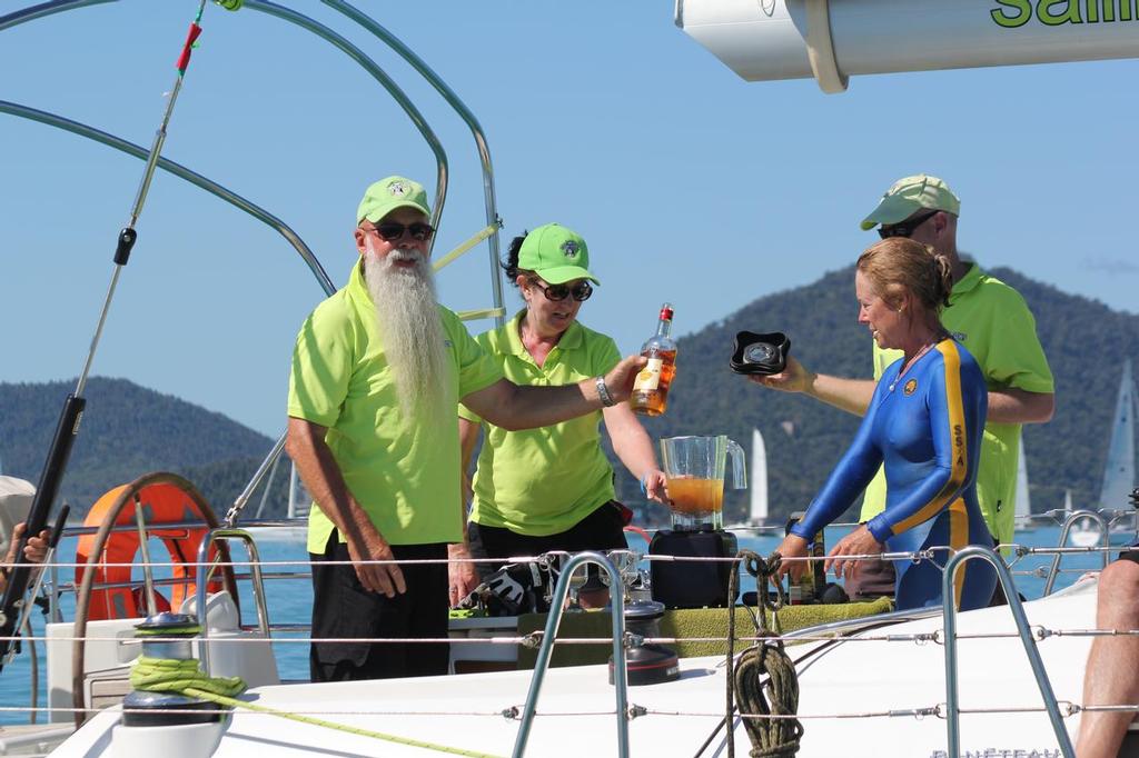 John Clinton blending drinks aboard Holy Cow supervised by Kim (in blue) - Abell Point Marina Airlie Beach Race Week 2013 photo copyright Sail-World.com http://www.sail-world.com taken at  and featuring the  class