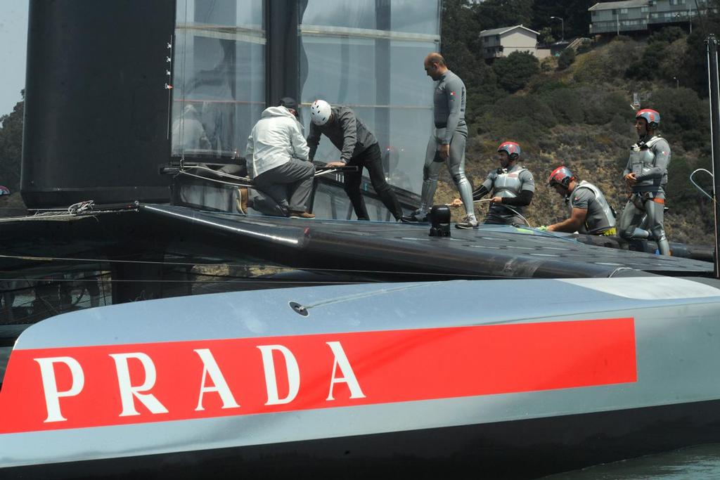 Checking out the damage on August 19, 2013 at the Louis Vuitton Cup in San Francisco California ©  SW