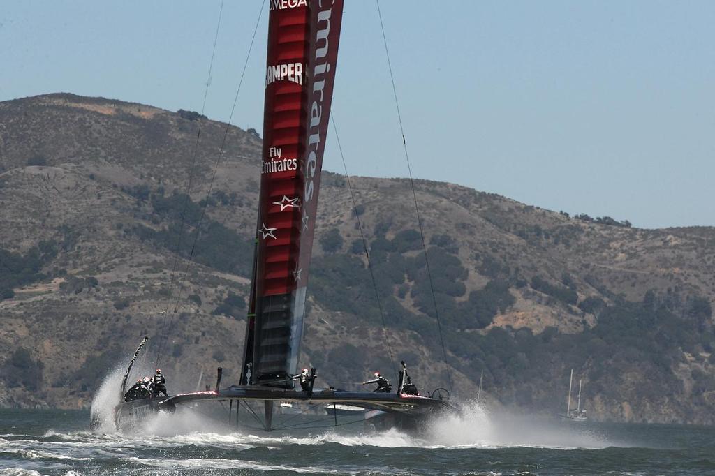Emirates Team New Zealand flies to leeward and then to the finish to win the 7th match race of the Louis Vuitton Cup final on August 24, 2013 in San Francisco, California.  ©  SW