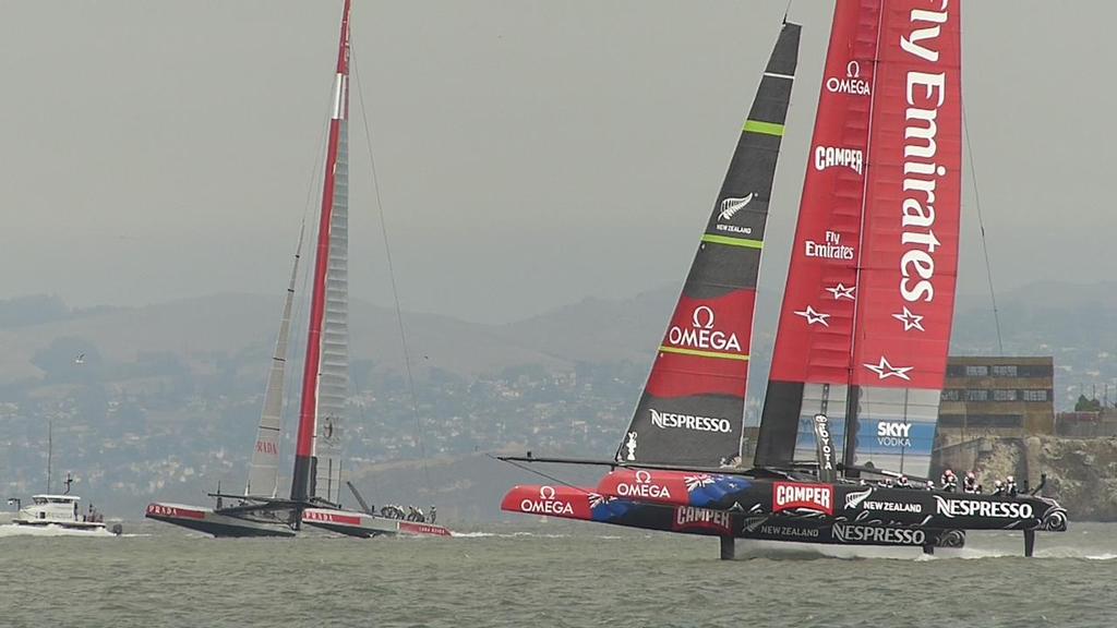 Emirates Team NZ foiling upwind at just under 30kts, while Luna Rossa tacks in Race 6 of the Louis Vuitton Cup Final © John Navas 