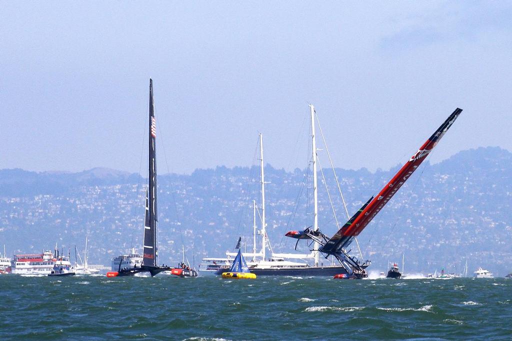 Oracle Team USA v Emirates Team New Zealand. America's Cup Day 5 San Francisco. Emirates Team NZ comes close to a capsize in Race 8 as Oracle Team USA avoids photo copyright Richard Gladwell www.photosport.co.nz taken at  and featuring the  class
